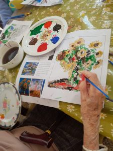 Residents taking part in a creative painting activity at Ashton Manor Care Home in Lancaster