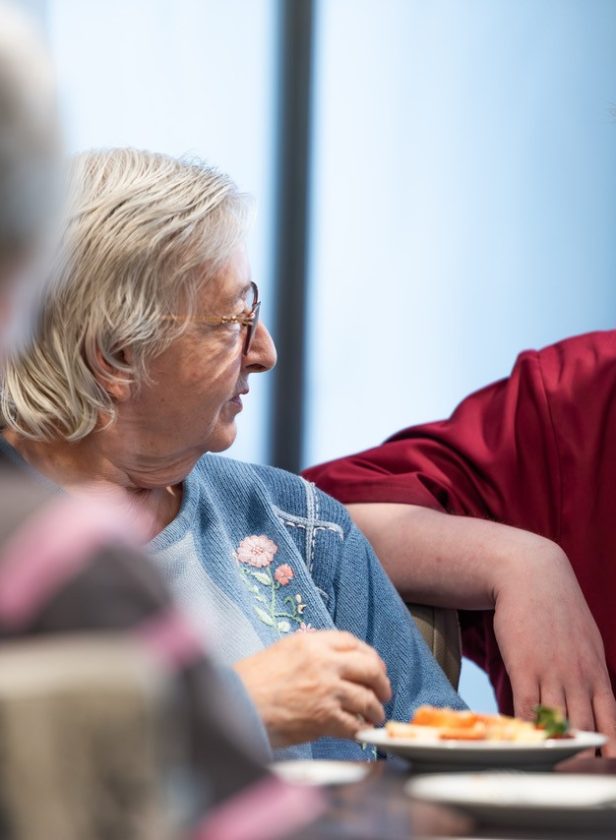 resident speaking to a member of staff