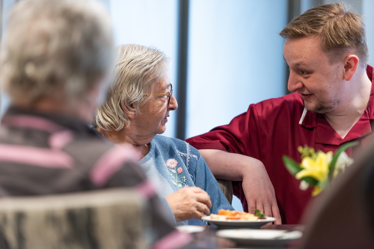 resident speaking to a member of staff