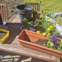 Residents enjoy ‘Potting Party’ in the garden at Astley View Care Home