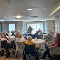 Residents enjoy live music at Ashton Manor Care Home