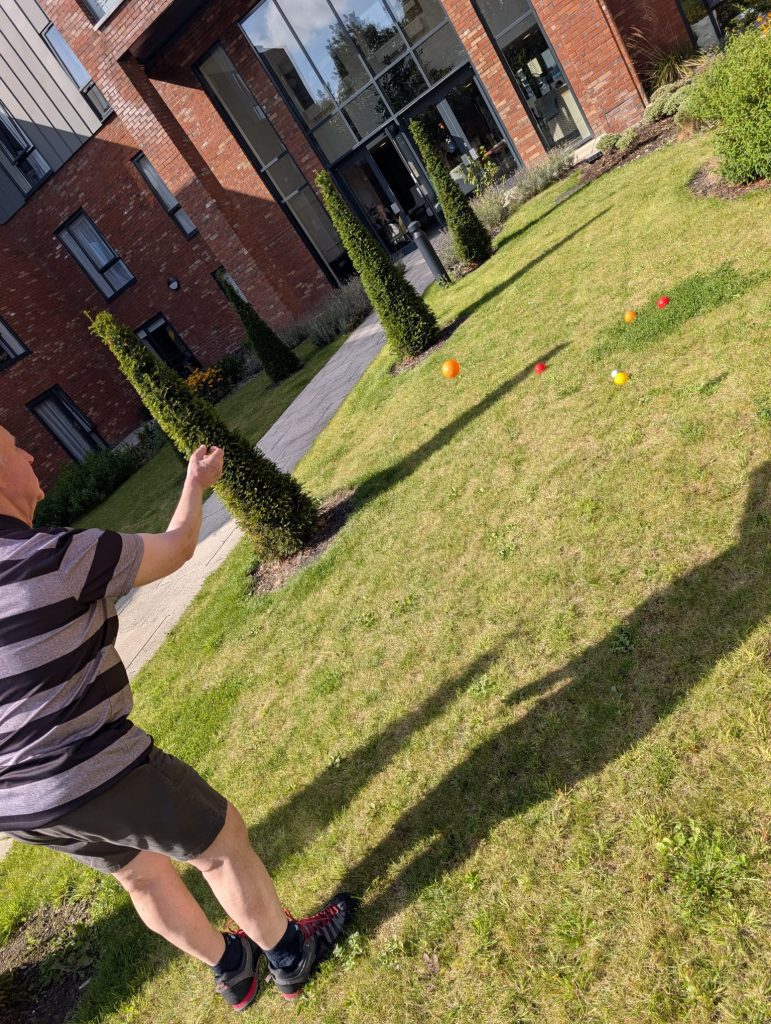 a resident playing petong in Astley View Care Home in Chorley 