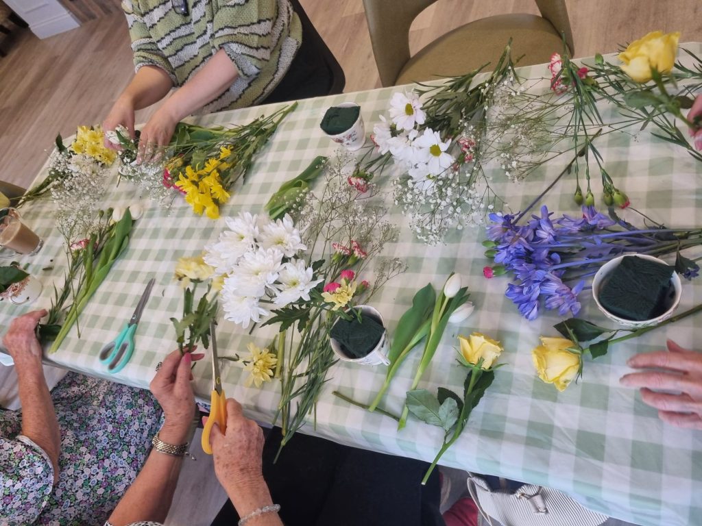 residents enjoying flower arranging