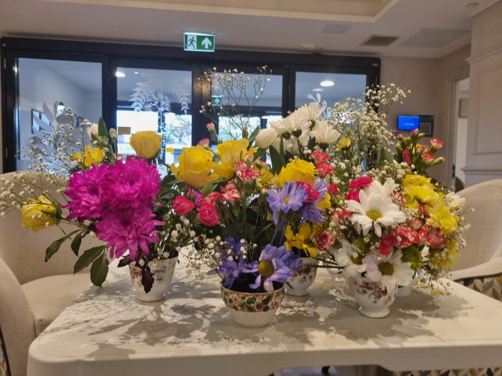 Residents at Astley View Care Home share flower-arranging skills