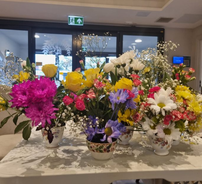 Residents at Astley View Care Home share flower-arranging skills